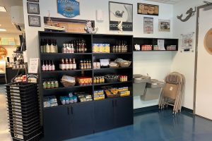 Interior photo of Sierra Gold Seafood market. there are shelves of various products.